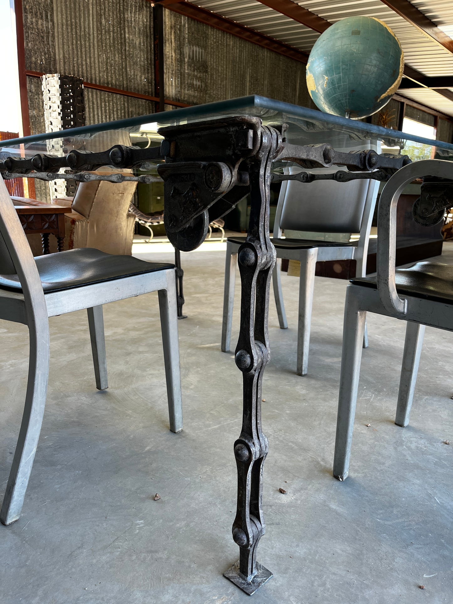 Steel “chain link” table with glass top