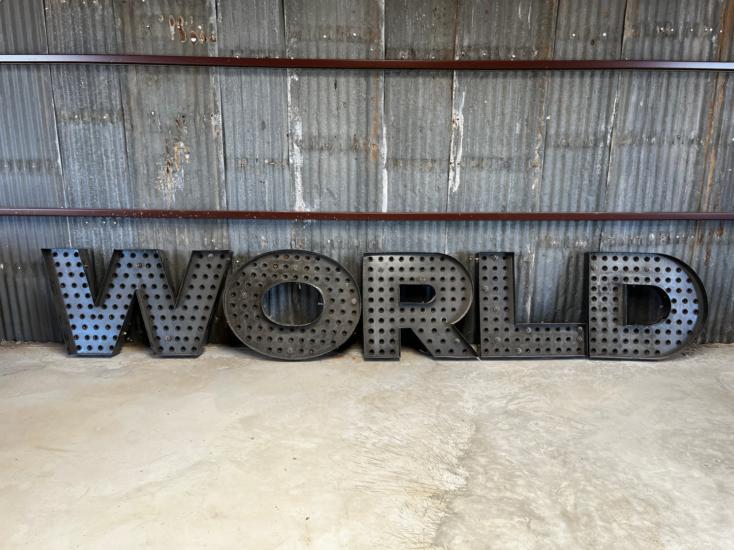 “World” steel letters