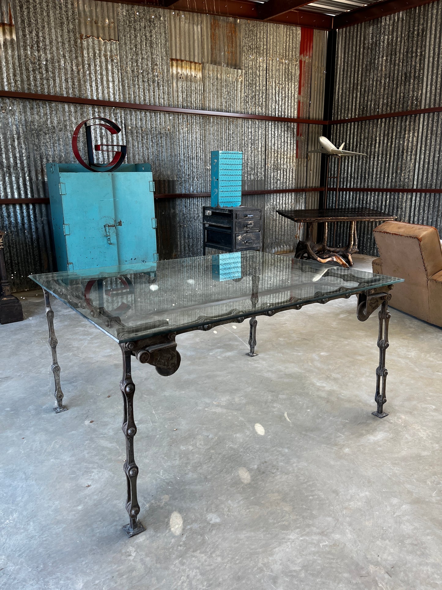 Steel “chain link” table with glass top