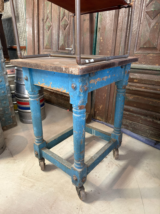 Wooden table on casters