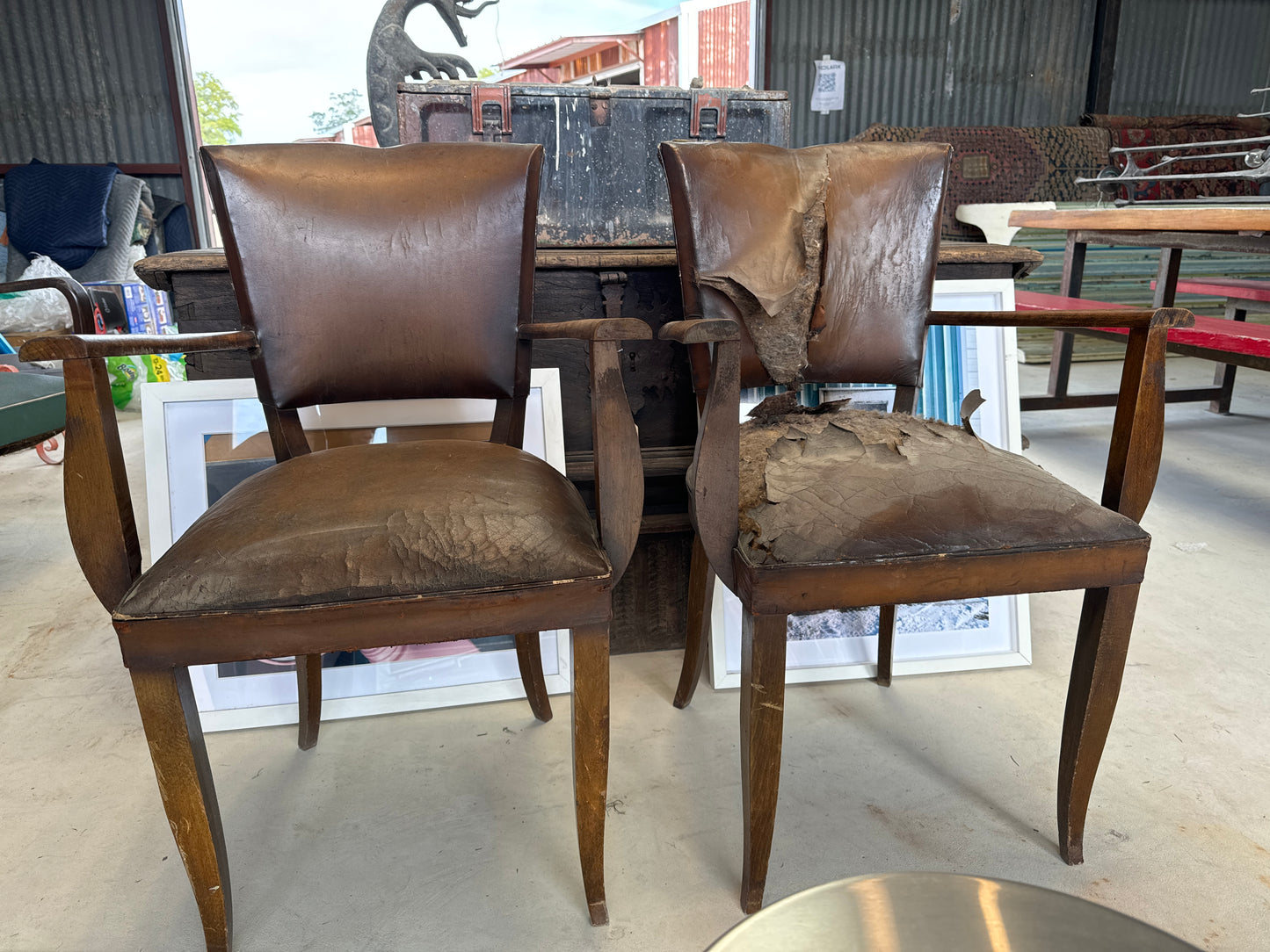 Pair of wooden armchairs with leather upholstery